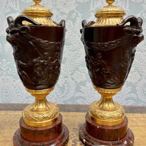 A Pair of Bronze and Griotte Marble Cassolettes after a model by Clodion